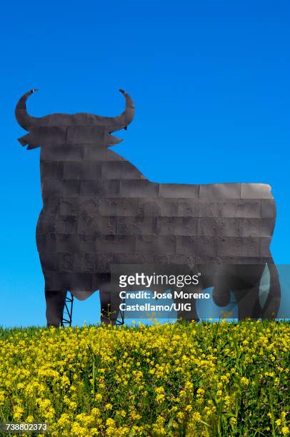 "bull silhouette, typical advertising of spanish sherry osborne, spain" - bull billboard spain stock pictures, royalty-free photos & images