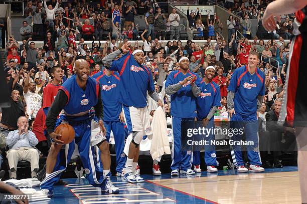 Sam Cassell, Corey Maggette, James Singleton, Daniel Ewing and Paul Davis of the Los Angeles Clippers get pumped up after a made shot against the...