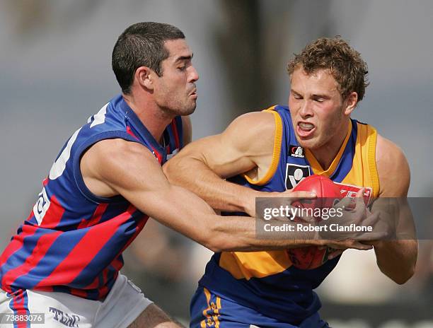 John Baird of Port Melbourne looks to tackle Brent McCaffer of Williamstown during the round two VFL match between Williamstown and Port Melbourne at...