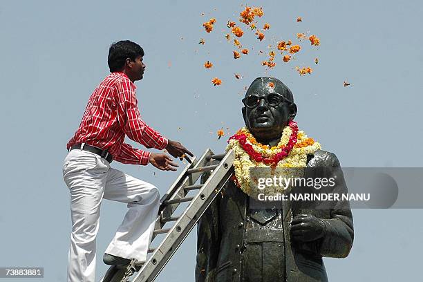 An Indian, Subash Chander, , places flowers on the statue of B R Ambedkar on the occassion of his birth anniversay, at Amritsar, 14 April 2007....