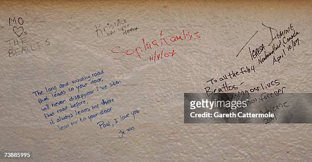 Messages left by fans of the Beatles adorn a wall outside Abbey Road Studios in North London on April 14, 2007 in London.