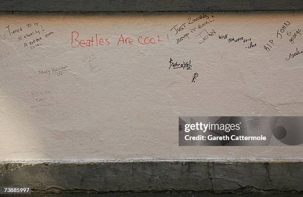 Messages left by fans of the Beatles are seen on a wall outside Abbey Road Studios in North London on April 14, 2007 in London.
