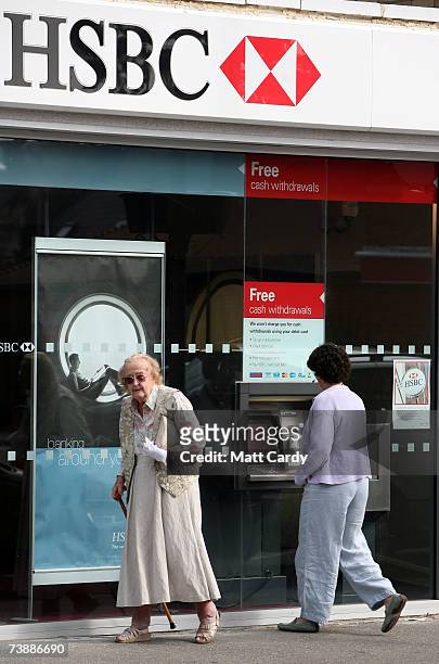 Woman uses a cash machine outside the branch of HSBC in Canford Cliff on April 14 2007 in Poole, Dorset. The area has some of the most expensive and...