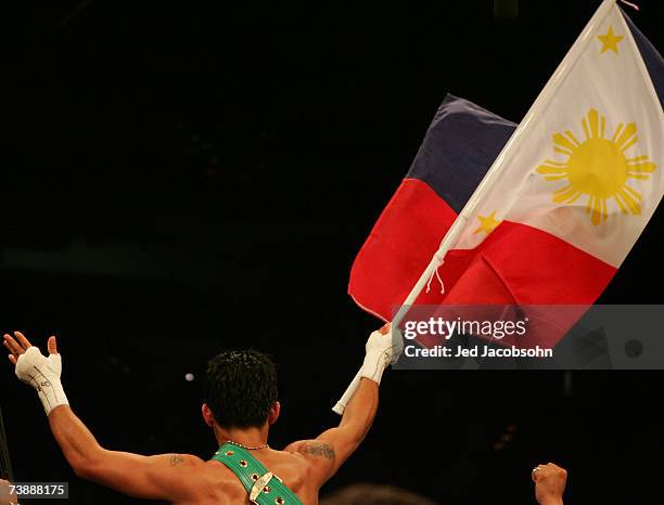 Manny Pacquiao of the Philippines celebrates after defeating Jorge Solis of Mexico during the WBC International Featherweight Championship April 14,...