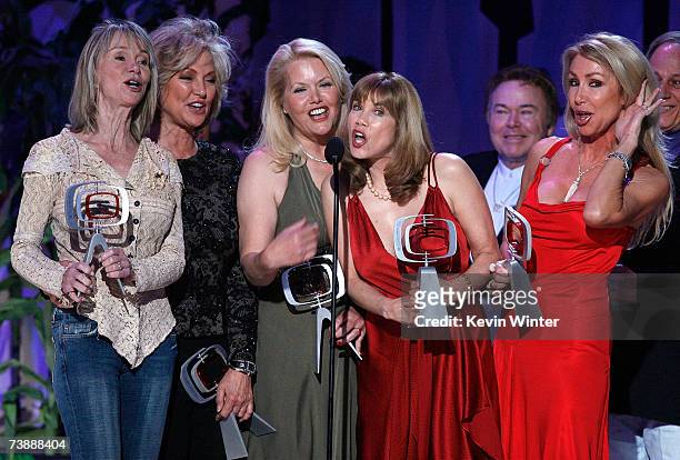 Actors Marianne Gordon Rogers, Gunilla Hutton, Misty Rowe, Barbi Benton, Roy Clark and Linda Thompson accept the Entertainers Award onstage during...