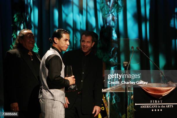 Actor Rudy Youngblood receives a Best Actor award from director Mel Gibson for his role in "Apocalypto" at the 15th Annual First Americans in the...