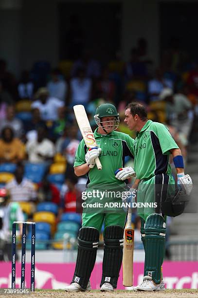 Ireland's Captain Trent Johnston talks with Kevin O'Brien during the match against Bangladesh during the Super-Eight ICC World Cup cricket match at...