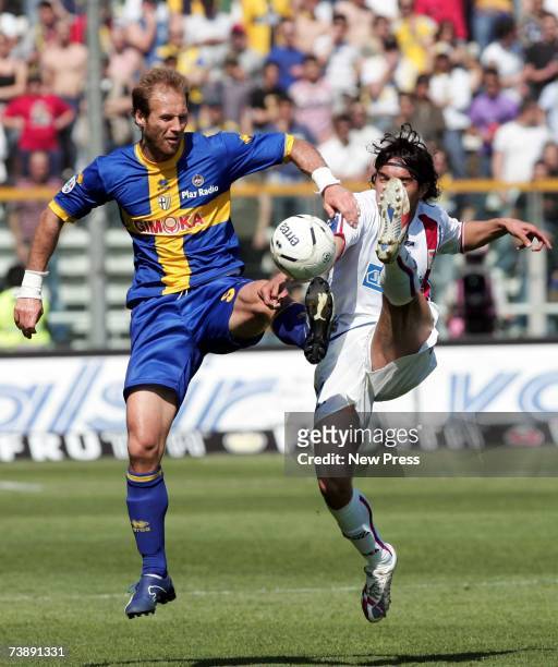 Zlatan Muslimovic of Parma is tackled by Juan Manuel Vargas of Catania during the Seria A league match between Parma and Catania at the Stadio Ennio...