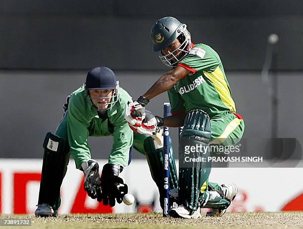 Bangladesh's Mohammad Ashraful plays a shot as Ireland's Wicket Keeper Niall O'Brien looks on, during the Super-Eights ICC World Cup cricket match at...