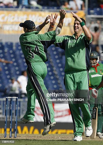 Ireland's William Porterfield and Boyd Rankin celebrates the wicket of Bangladesh's Mohammad Ashraful, during the Super-Eights ICC World Cup cricket...