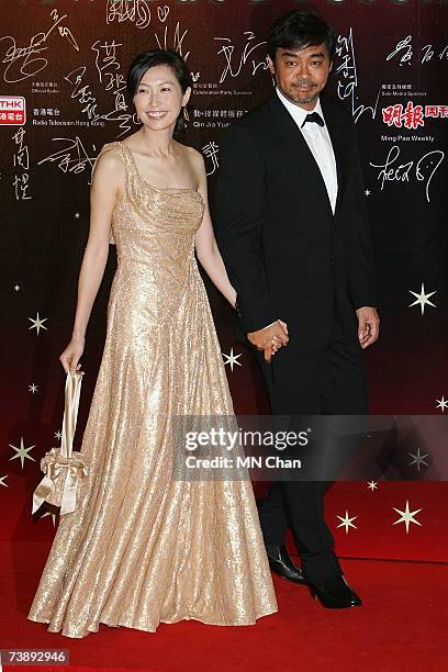 Actor Lau Ching Wan and his wife arrive at the 26th Hong Kong Film Awards at the Hong Kong Cultural Centre on April 15, 2007 in Hong Kong, China.