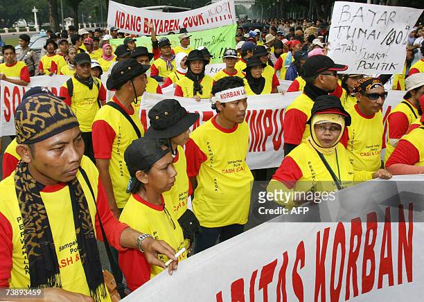 Victims of the Sidoarjo mudflow shout slogans during a demonstration urging the goverment and oil company PT Lapindo Brantas to pay compensation for...