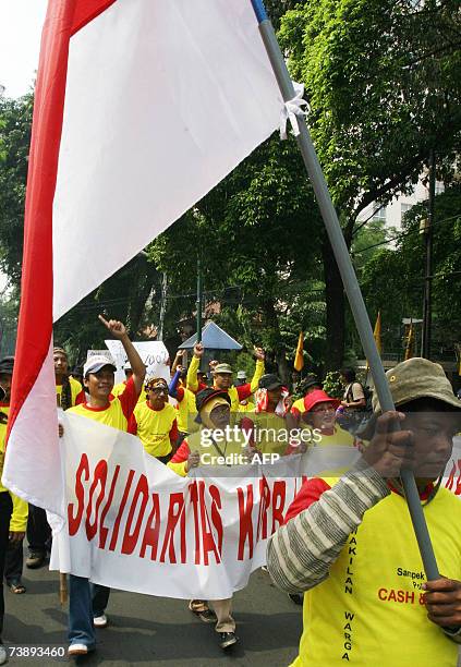 Victims of the Sidoarjo mudflow shout slogans during a demonstration urging the goverment and oil company PT Lapindo Brantas to pay compensation for...