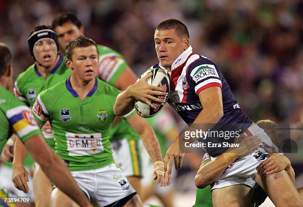 Shaun Kenny-Dowall of the Roosters is surrounded by the Raiders defence during the round five NRL match between the Canberra Raiders and the Sydney...