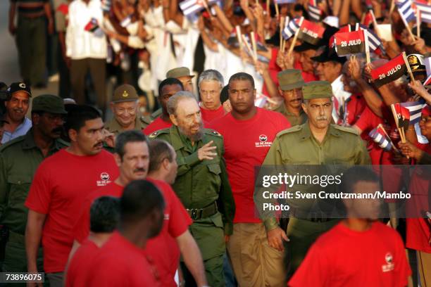 Fidel Castro walks during a political rally to celebrate the anniversary of his attack on the Monacada barracks in 1953 in this undated photo in...