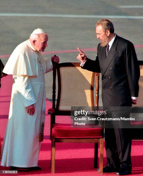 Fidel Castro gestures while talking with Pope John Paul II at the Jose Marti Airport in Havanna January 21, 1998 in Havana, Cuba.