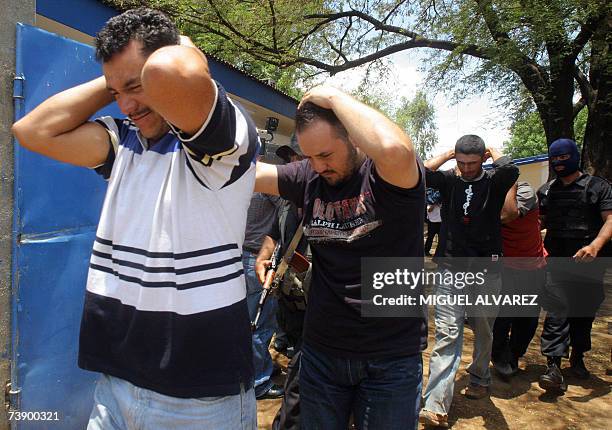 Four Nicaraguan, alleged members of the Mexican Sinaloa Cartel, are escorted by the Nicaraguan Police 16 April 2007 in Tipitapa town, 23 km east of...