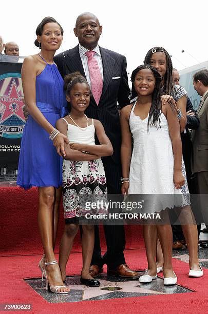 Hollywood, UNITED STATES: Actor Forest Whitaker, his wife Keisha and their three daughters pose near his star on the Hollywood Walk of Fame in...