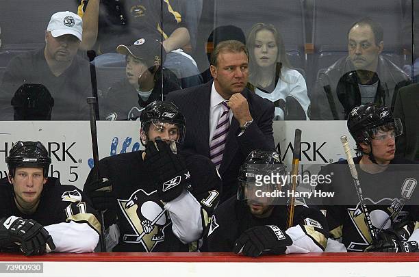 Jordan Staal, Erik Christensen, Head Coach Michel Therrien, Mark Recchi and Sidney Crosby of the Pittsburgh Penguins look on from the bench area...