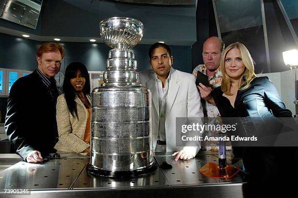 Actors David Caruso, Khandi Alexander, Adam Rodriguez, Rex Linn and Emily Procter pose with the Stanley Cup on the set of "CSI : Miami" at the...