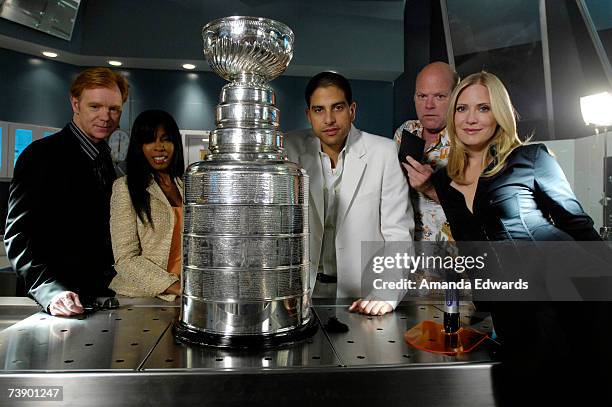 Actors David Caruso, Khandi Alexander, Adam Rodriguez, Rex Linn and Emily Procter pose with the Stanley Cup on the set of "CSI : Miami" at the...
