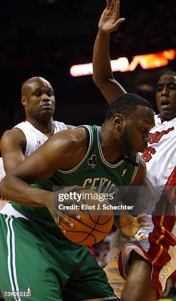 Al Jefferson of the Boston Celtics drives to the basket against Guard Eddie Jones of the Miami Heat on April 16, 2007 at the American Airlines Arena...