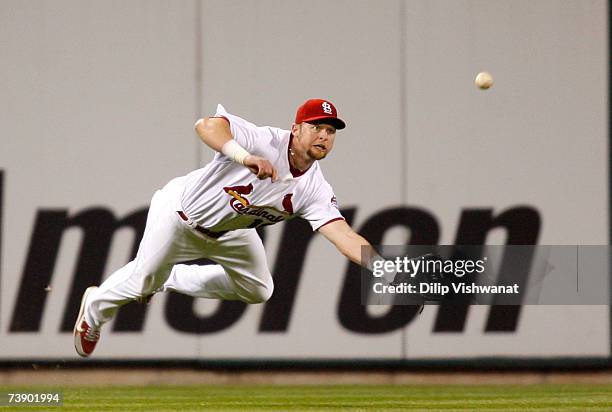 Chris Duncan of the St. Louis Cardinals makes a diving catch against the Pittsburgh Pirates on April 16, 2007 at Busch Stadium in St. Louis,...