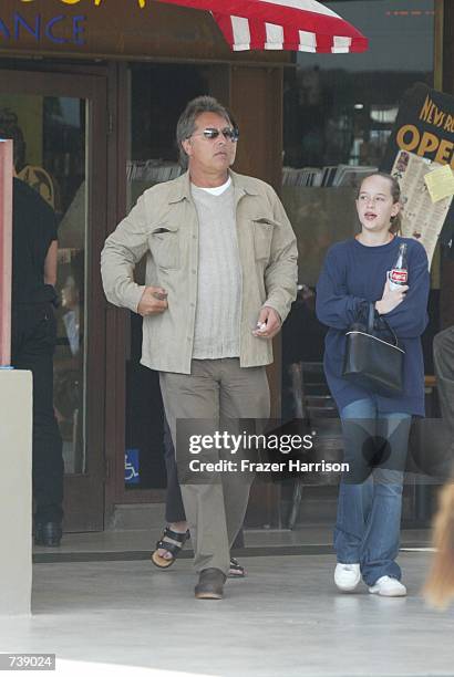 Actor Don Johnson leaves the Newsroom restaurant after having lunch with his pregnant wife Kelley Phleger and his daughter Dakota from his marriage...