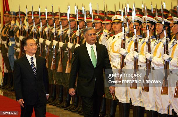 Visiting Prime Minister of Pakistan, Shaukat Aziz walks beside his Chinese counterpart Wen Jiabao , during a review of the honour guard welcoming...