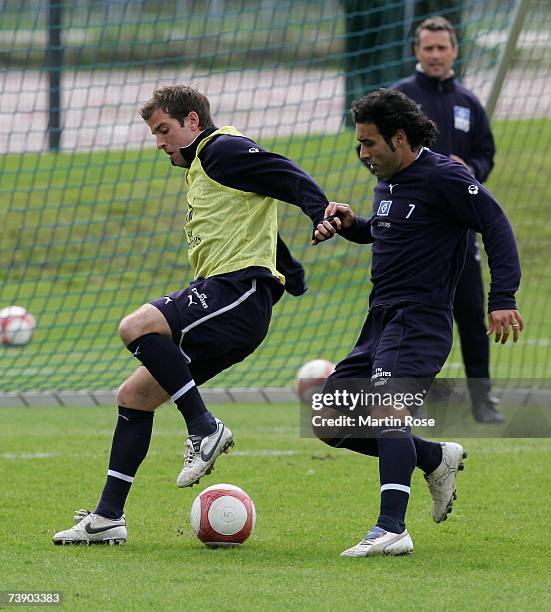 Rafel van der Vaart and Mehdi Mahdavikia of Hamburg fight for the ball during the Hamburger SV training session at the AOL Arena on April 17, 2007 in...