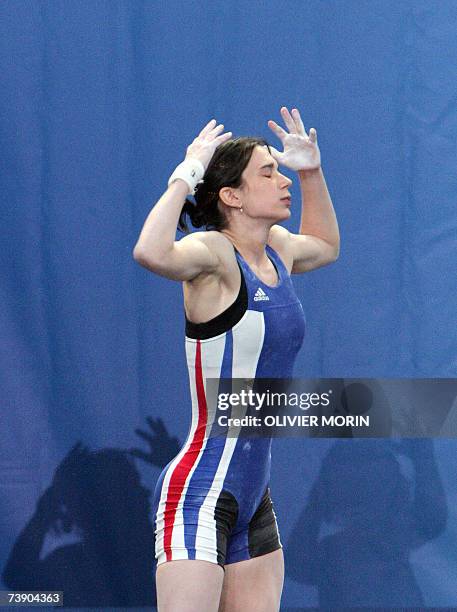 French Melanie Noel gestures during the +48kg class of the Weightlifting European Championship, 17 April 2007 in Strasbourg, eastern France. AFP...