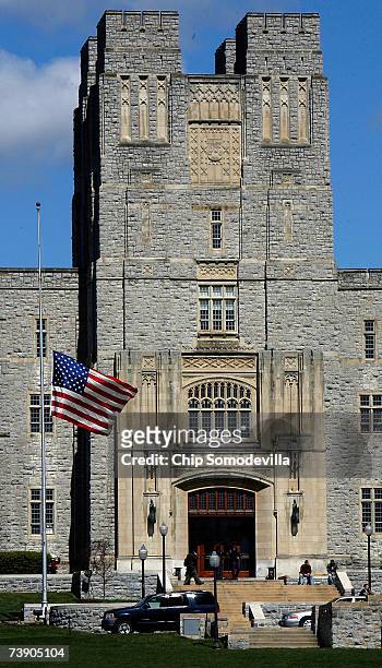 Flag flys at half-staff outside Burrus Hall on the campus of Virginia Tech where 33 people were shot and killed a day earlier April 17, 2007 in...