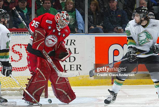 Kyle Gajewski of the Sault Ste. Marie Greyhounds watches the puck deflected by David Meckler of the London Knights in game 7 of the Western...