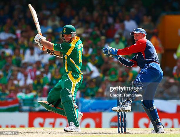 Graeme Smith of South Africa hits out watched by Paul Nixon of England during the ICC Cricket World Cup Super Eights match between South Africa and...