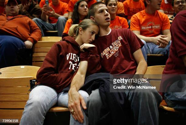 Virginia Tech students Ryan Eifert and Alison Parker comfort one another during during a convocation ceremony at Cassell Coliseum a day after a...
