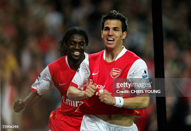 London, UNITED KINGDOM: Arsenal's Spanish midfielder Cesc Fabregas celebrates scoring his side's second goal with Togolese striker Emmanuel Adebayor...