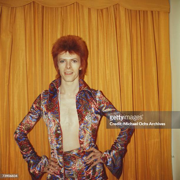 Rock and roll musician David Bowie poses for a portrait dressed as 'Ziggy Stardust' in a hotel room in 1973 in New York City, New York.