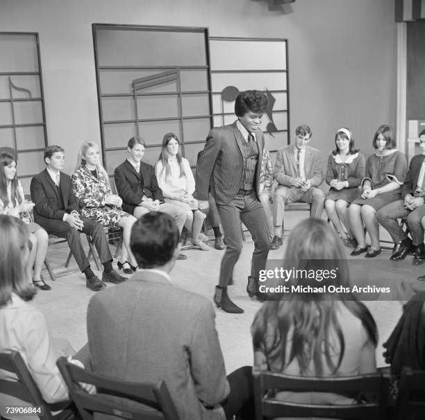 Soul singer James Brown performs at KCOP Studios on the Lloyd Thaxton Show in 1964 in Los Angeles, California.