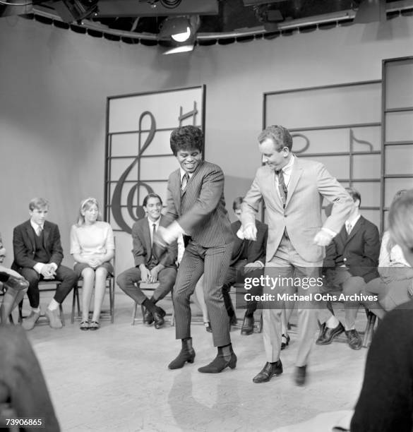 Soul singer James Brown performs at KCOP Studios on the Lloyd Thaxton Show with Lloyd Thaxton in 1964 in Los Angeles, California.