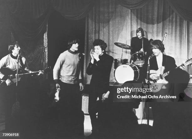 Rock band "The Byrds" performs onstage at Ciro's Nightclub with Bob Dylan on harmonica in 1965 in Los Angeles, California. David Crosby, Gene Clark,...