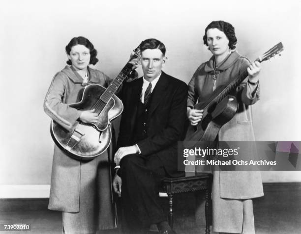 Country music group The Carter Family pose for a portrait Maybelle Carter, Alvin P.Carter and Sara Carter circa 1937.