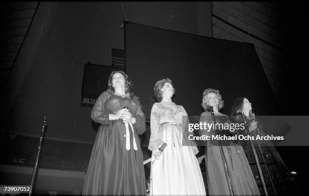 Country singing group the Carter Sisters with Jan Howard perform onstage with Johnny Cash at the Anaheim Convention Center on March 11, 1978 in...