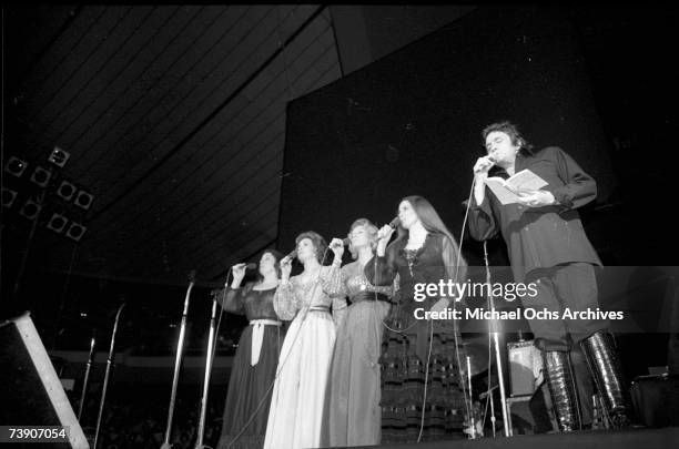 Country singer/songwriter Johnny Cash performs onstage with the Carter Sisters at the Anaheim Convention Center on March 11, 1978 in Anaheim,...