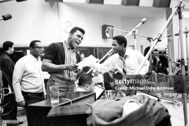 Soul Singer Sam Cooke and boxer Muhammad Ali record 'The Gang's All Here' at Columbia Studios on March 3, 1964 in New York City, New York. (