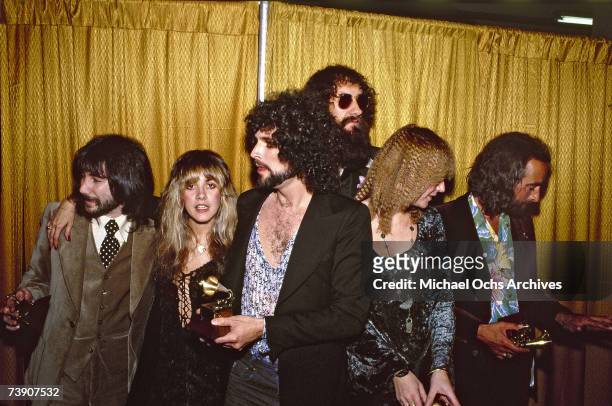 Rock group Fleetwood Mac wins the Album of the year award at the 20th Grammy awards at the Shrine Auditorium. Left to right producer Richard Dashut,...