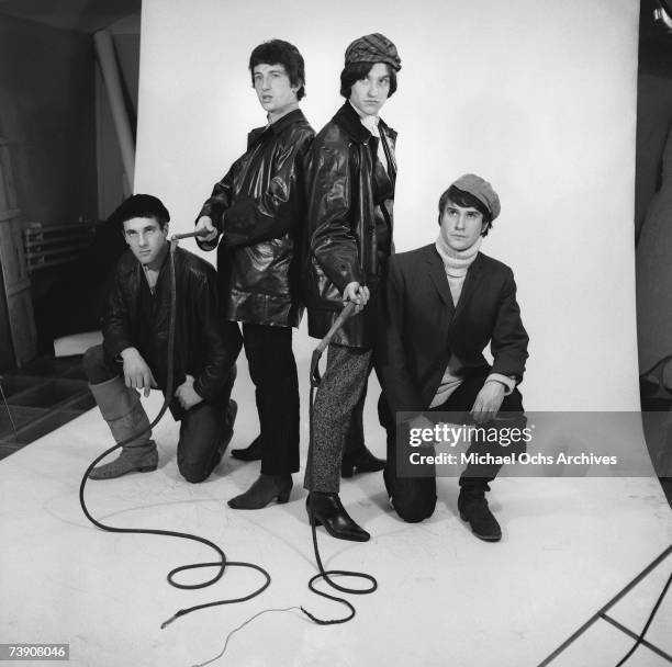Mick Avory, Peter Quaife, Ray Davies, Dave Davies of the rock group "The Kinks" pose for a portrait session wearing black leather jackets in the...