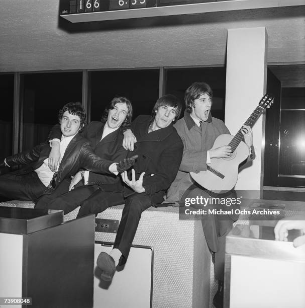 Mick Avory, Dave Davies, Peter Quaife, Ray Davies of the rock group "The Kinks" pose for a picture in the airport on their way to their first US tour...