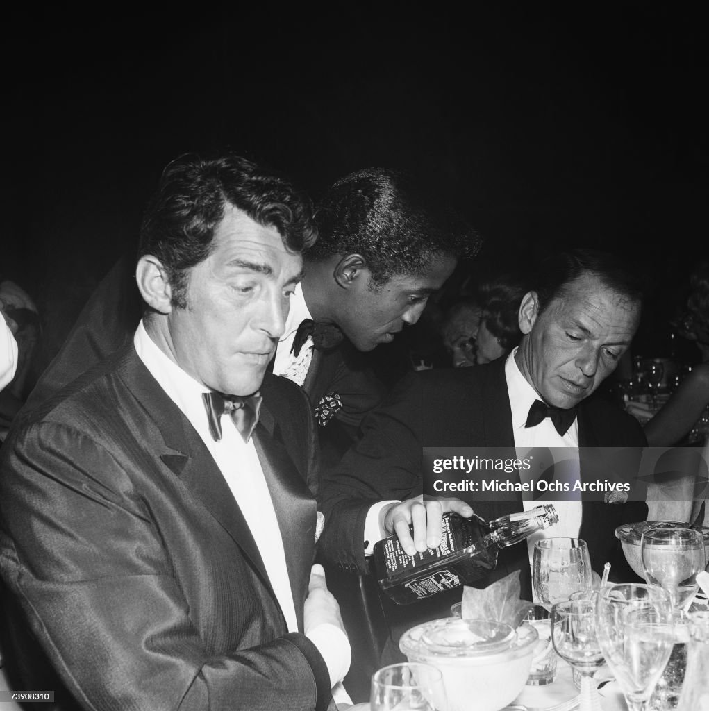 Rat Pack Members With A Bottle Of Jack