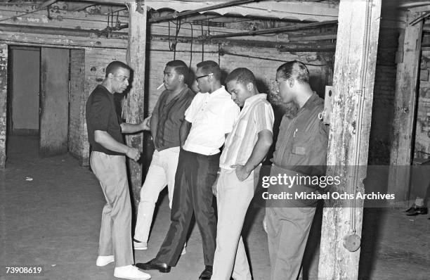 Vocal group "The Four Tops" rehearse with their choreographer, Cholly Atkins, in the basement of the Apollo Theatre in 1964 in New York City, New...