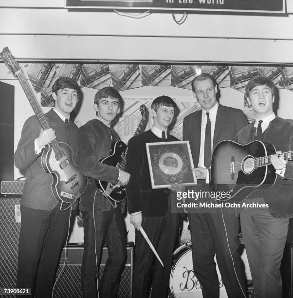 Rock and roll band "The Beatles" poses for a portrait with their producer George Martin. Paul McCartney, George Harrison, Ringo Starr, producer...